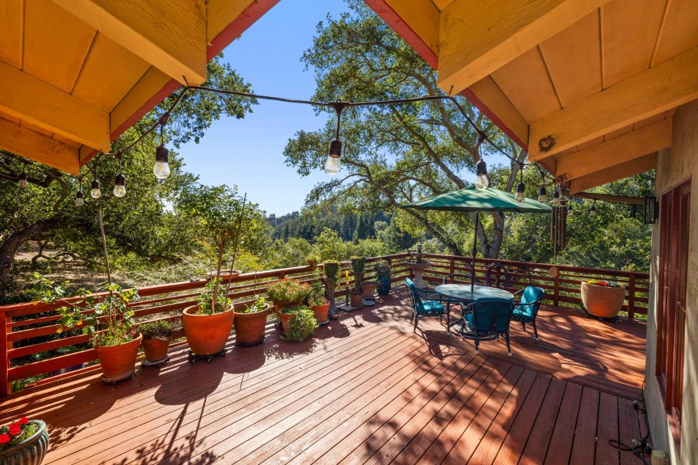 4710 North Rodeo Gulch Road Soquel, CA 95073 - Photo 42 of 97 a view of a balcony with chairs and wooden floor