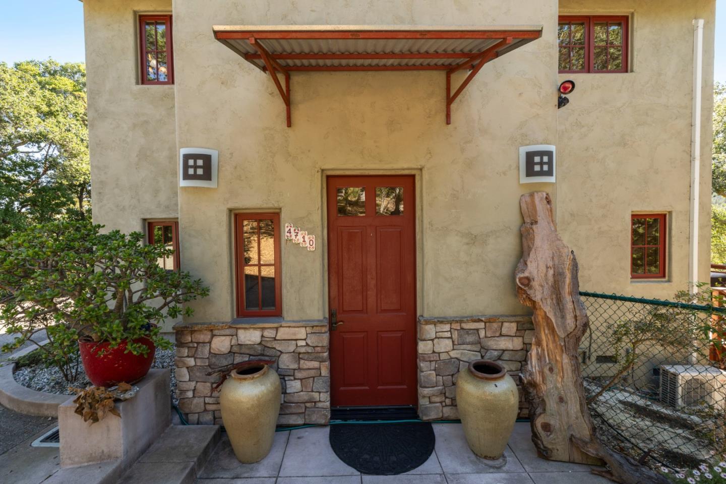 4710 North Rodeo Gulch Road Soquel, CA 95073 - Photo 5 of 97 a front view of a house with outdoor seating