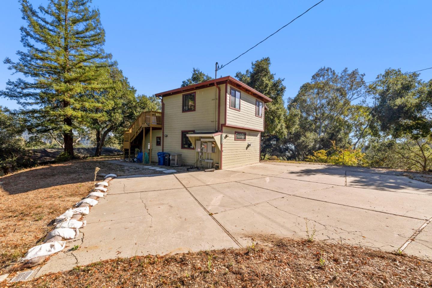 4710 North Rodeo Gulch Road Soquel, CA 95073 - Photo 61 of 97 a front view of a house with a yard and garage