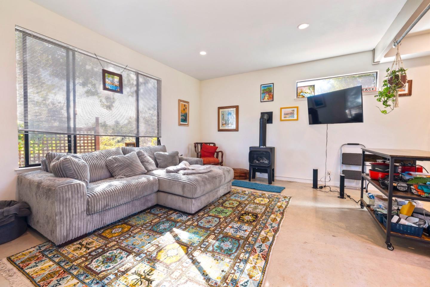 4710 North Rodeo Gulch Road Soquel, CA 95073 - Photo 66 of 97 a living room with furniture and a flat screen tv