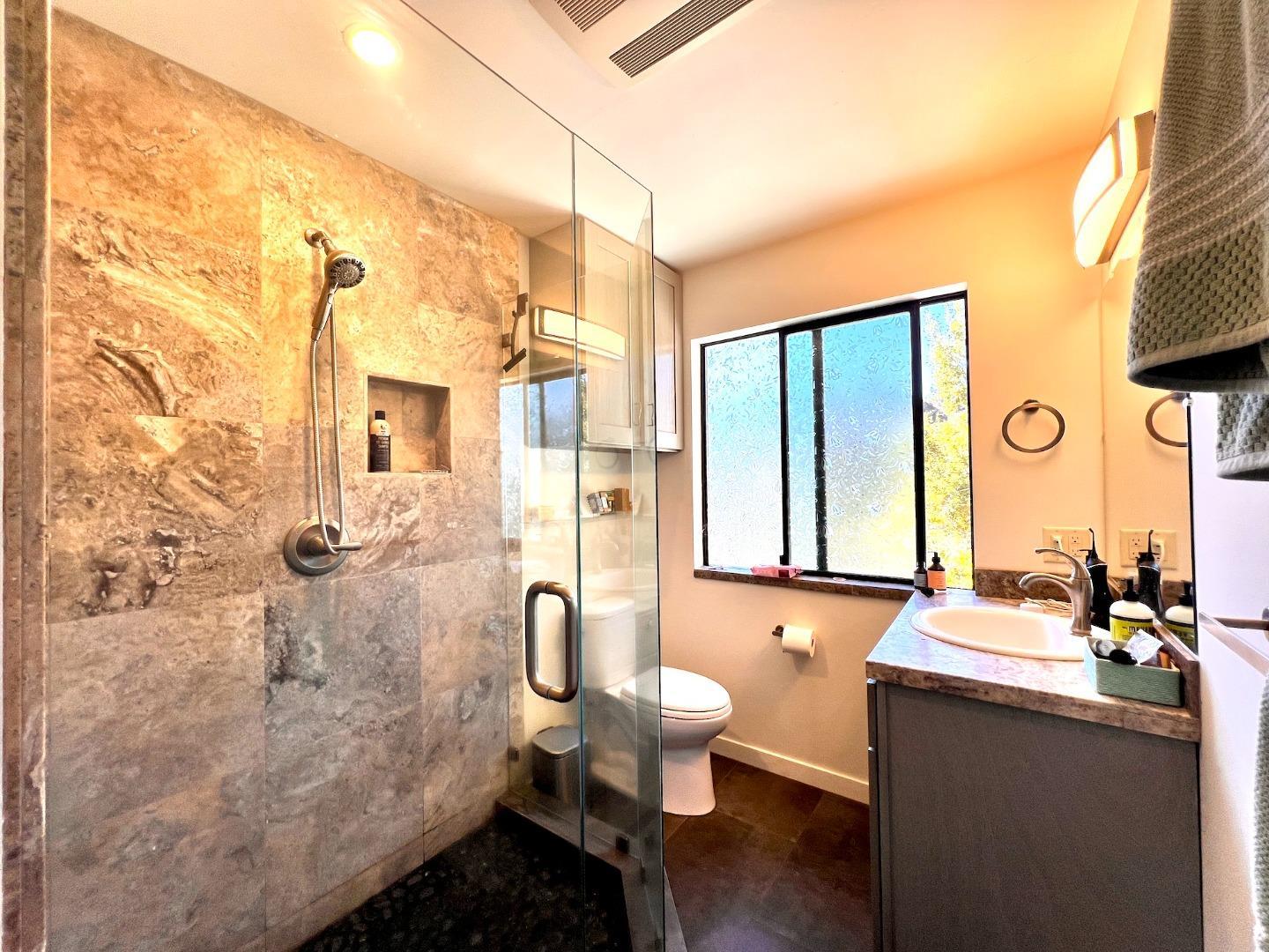 4710 North Rodeo Gulch Road Soquel, CA 95073 - Photo 73 of 97 a bathroom with a sink toilet and shower