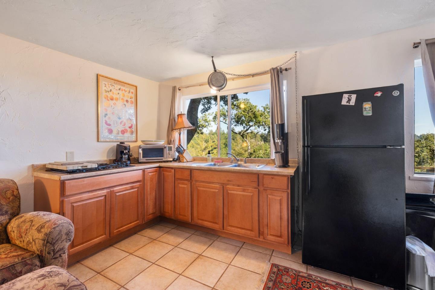 4710 North Rodeo Gulch Road Soquel, CA 95073 - Photo 88 of 97 a kitchen with stainless steel appliances granite countertop a refrigerator and a sink