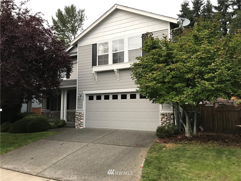 2226 Southeast 2nd Place Renton, WA 98056 - Photo 1 of 20 a front view of a house with a yard