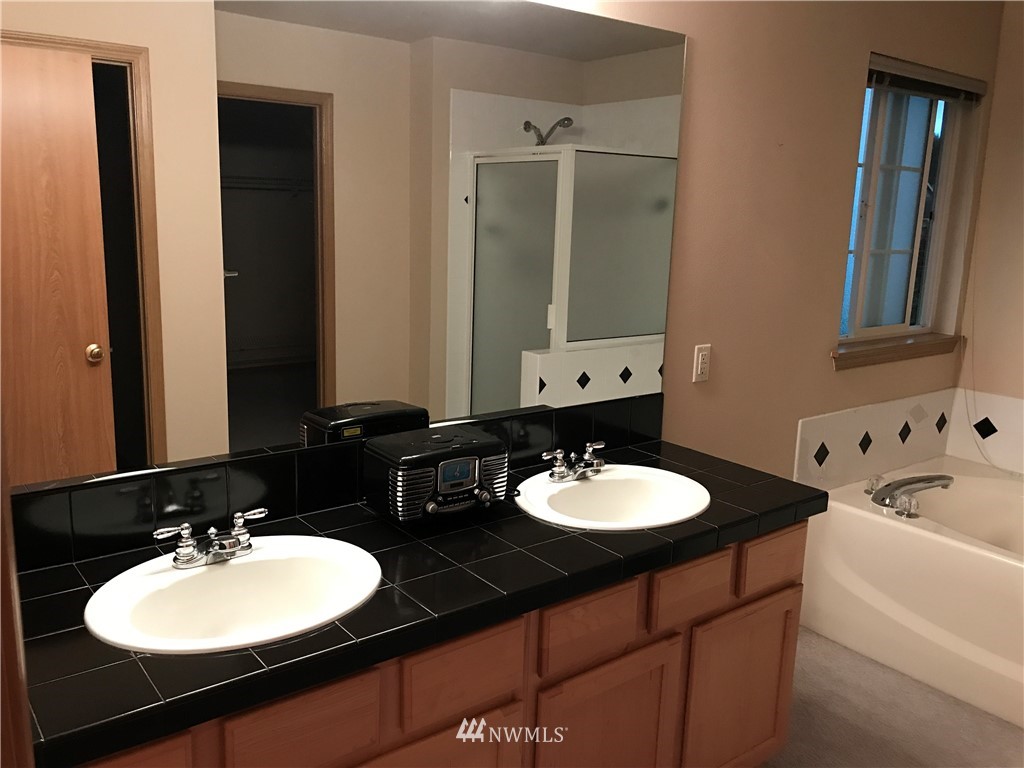 2226 Southeast 2nd Place Renton, WA 98056 - Photo 12 of 20 a bathroom with a double vanity sink and a mirror