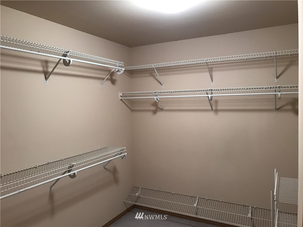 2226 Southeast 2nd Place Renton, WA 98056 - Photo 13 of 20 a view of a room with racks on the wall