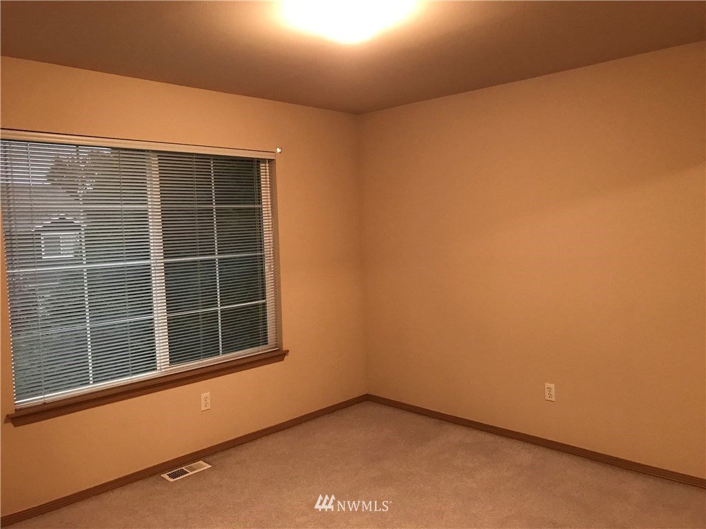 2226 Southeast 2nd Place Renton, WA 98056 - Photo 16 of 20 a view of an empty room with a window