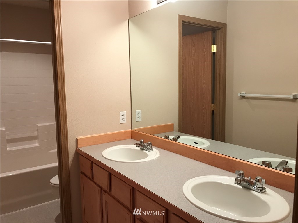 2226 Southeast 2nd Place Renton, WA 98056 - Photo 18 of 20 a bathroom with a sink and a mirror