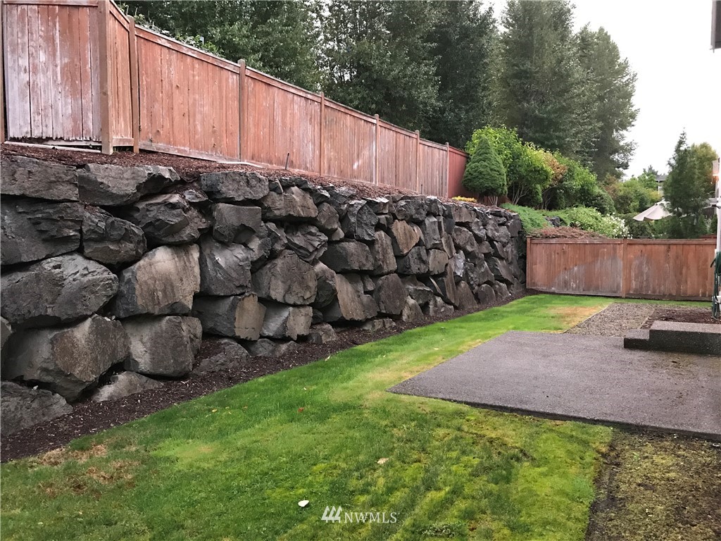 2226 Southeast 2nd Place Renton, WA 98056 - Photo 20 of 20 a view of a backyard with wooden fence