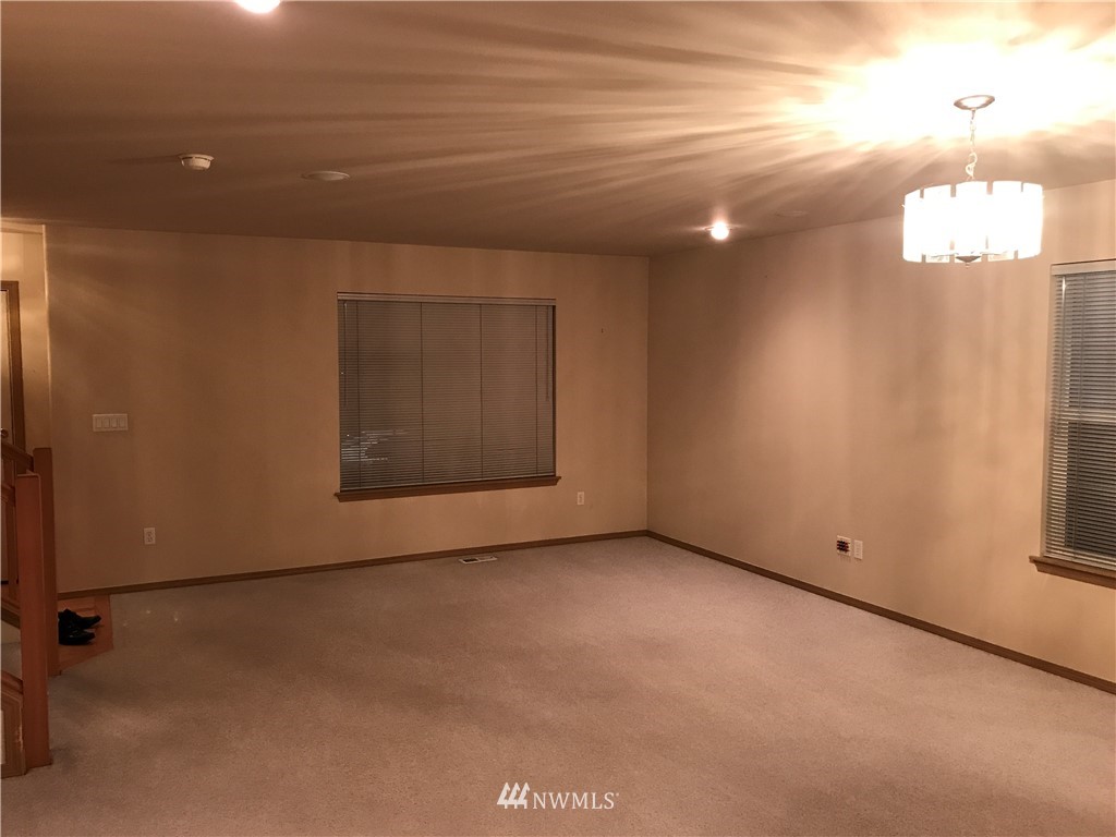 2226 Southeast 2nd Place Renton, WA 98056 - Photo 3 of 20 a view of an empty room with a window