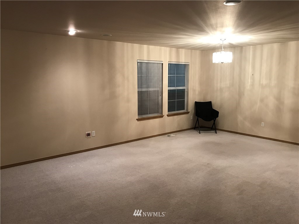 2226 Southeast 2nd Place Renton, WA 98056 - Photo 4 of 20 an empty room with a empty space and windows