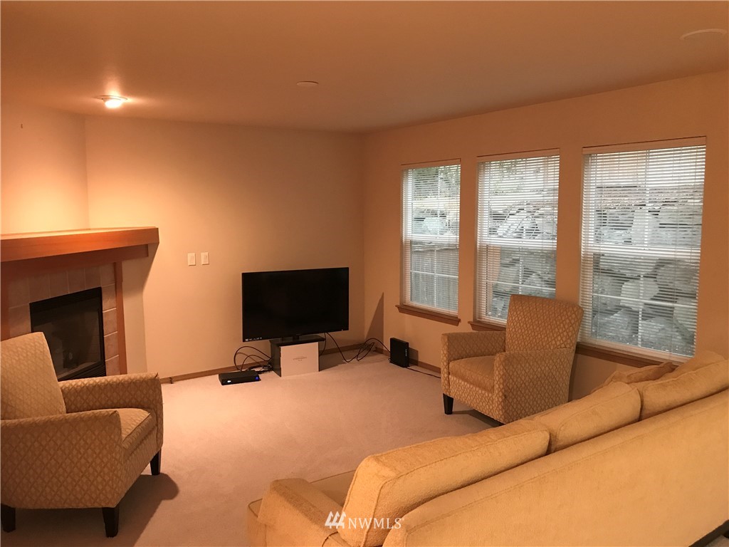 2226 Southeast 2nd Place Renton, WA 98056 - Photo 5 of 20 a bedroom with furniture and a flat screen tv