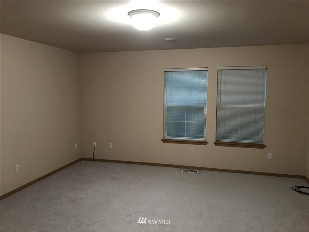 2226 Southeast 2nd Place Renton, WA 98056 - Photo 10 of 20 an empty room with a window