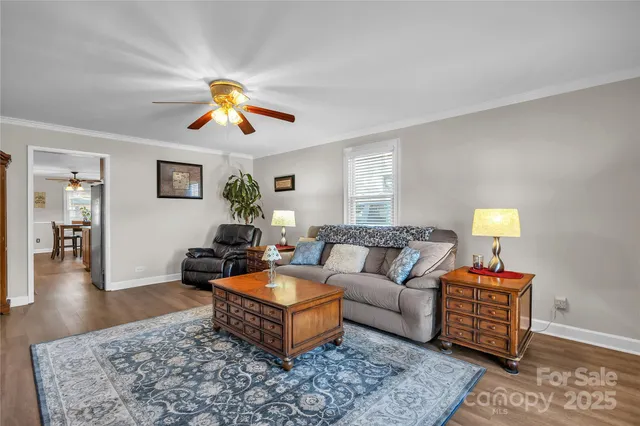a living room with furniture rug and window