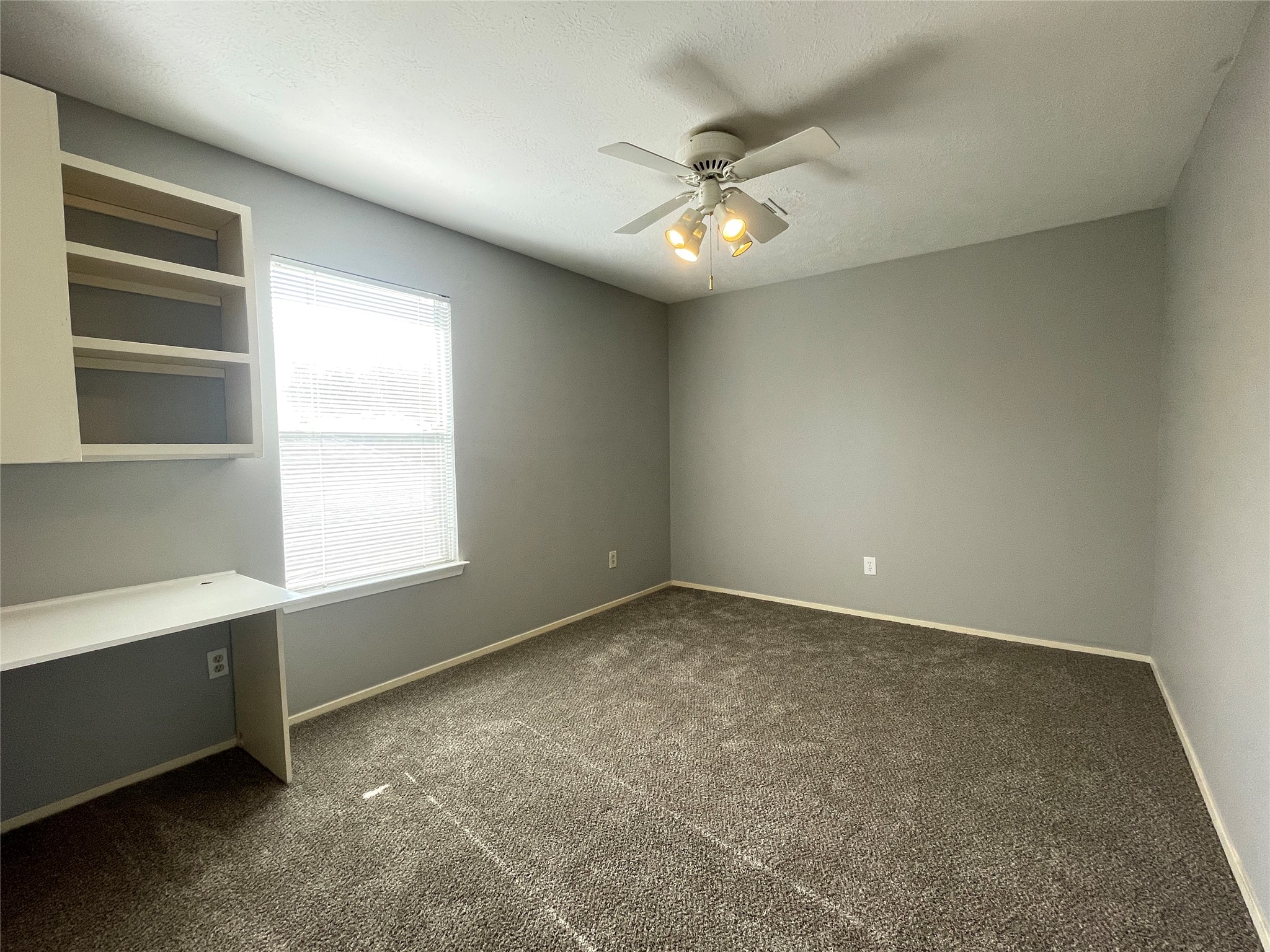 5006 Temple Bell Drive Spring, TX 77388 - Photo 21 of 27 Secondary bedroom 2 featuring built-in desk