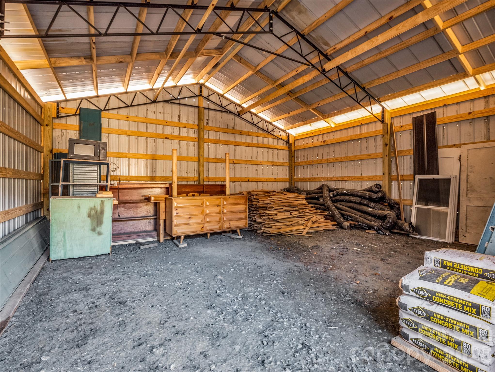 530 Mine Creek Road Bakersville, NC 28705 - Photo 17 of 18 a view of a garage room with wooden roof