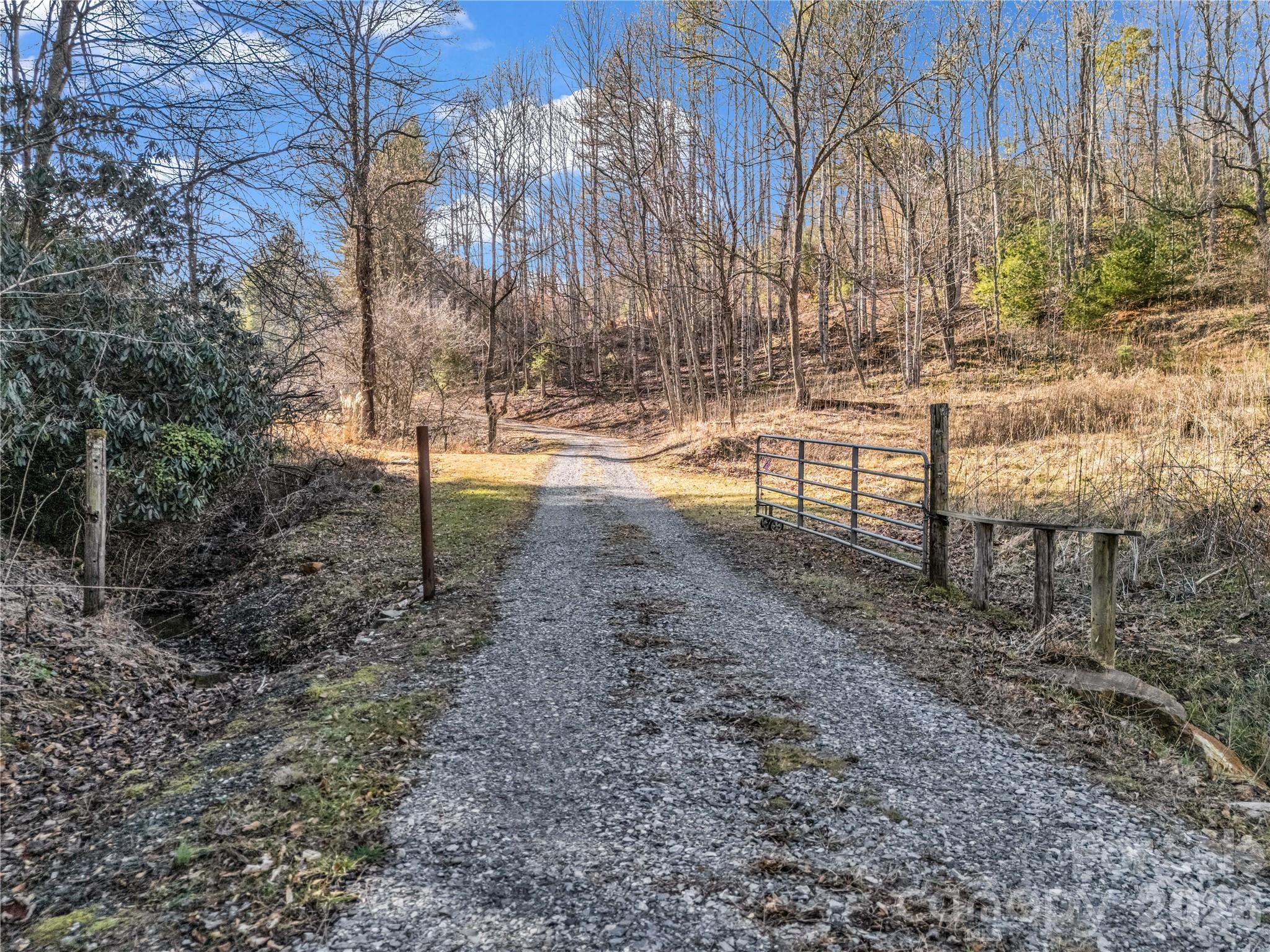 530 Mine Creek Road Bakersville, NC 28705 - Photo 4 of 18 a view of yard with wooden fence