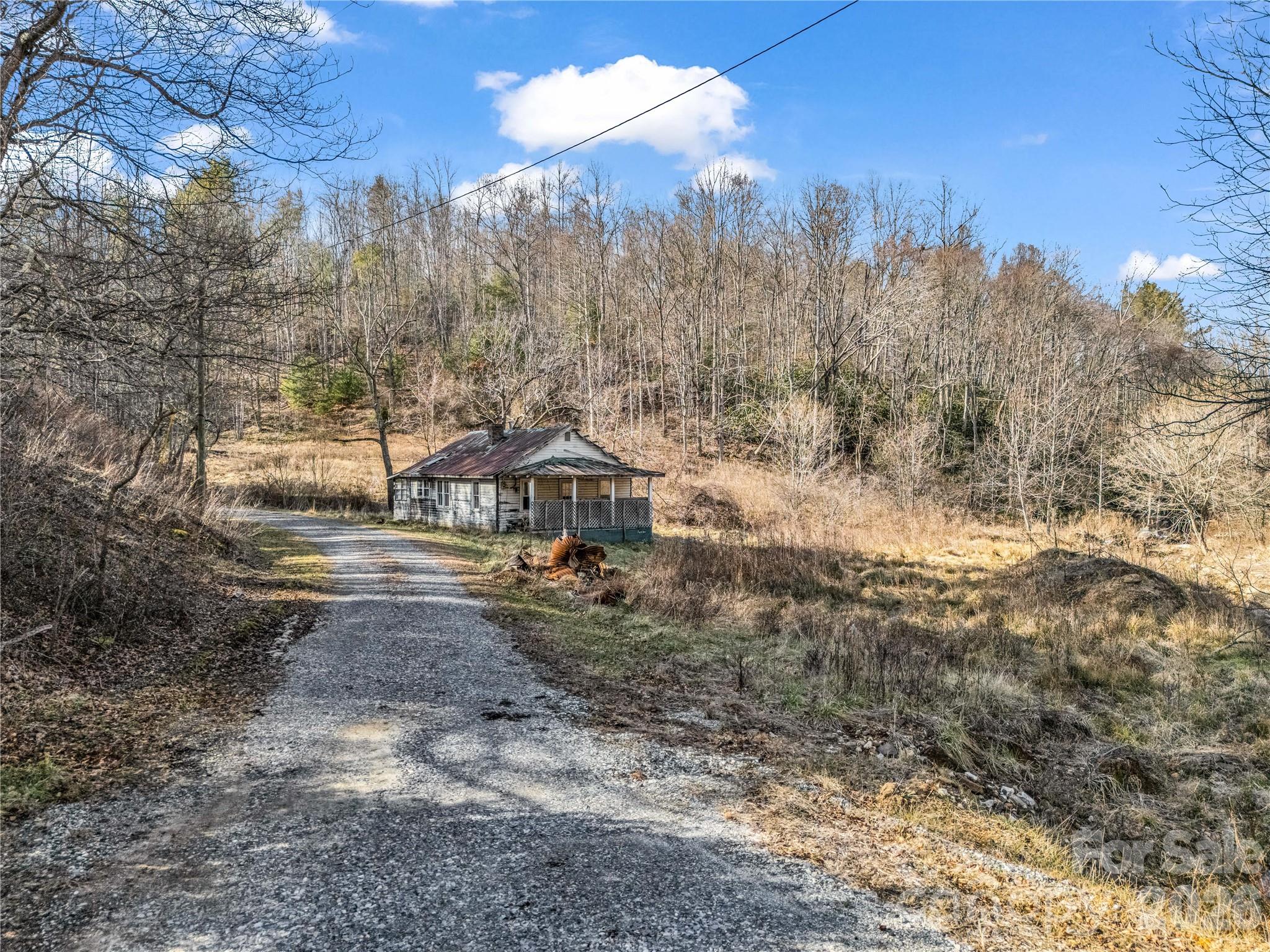 530 Mine Creek Road Bakersville, NC 28705 - Photo 5 of 18 a view of a yard in front of a house