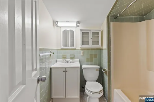 a bathroom with a toilet a sink and a shower