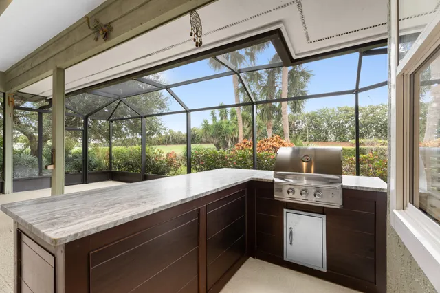 a kitchen with a sink and large window