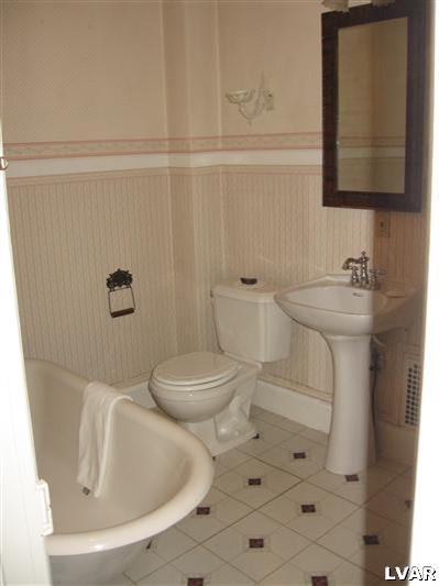 710 Spring Street Bethlehem, PA 18018 - Photo 8 of 8 a bathroom with a toilet sink and mirror