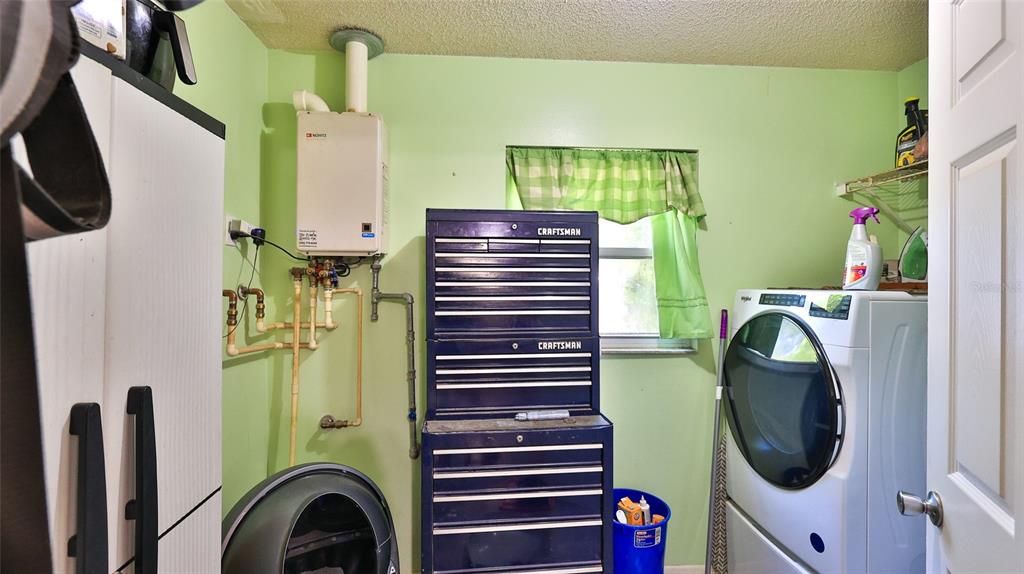 428 Perdita Avenue Edgewater, FL 32132 - Photo 13 of 28 a utility room with dryer and washer