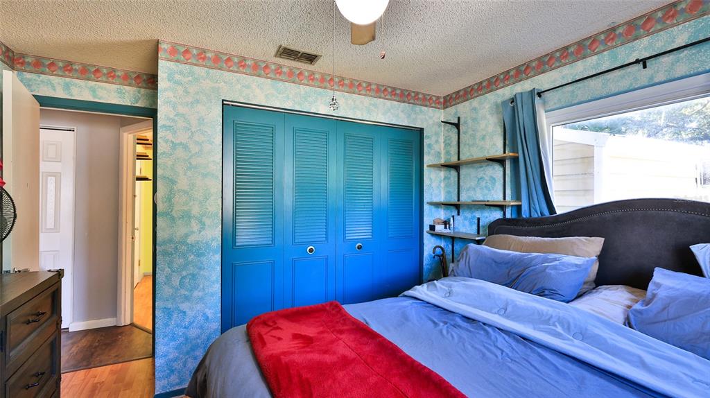 428 Perdita Avenue Edgewater, FL 32132 - Photo 15 of 28 a bed room with a bed and a television