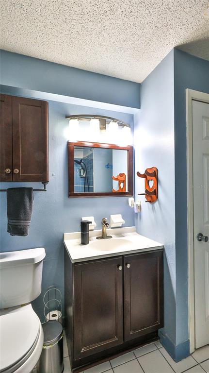 428 Perdita Avenue Edgewater, FL 32132 - Photo 17 of 28 a bathroom with a sink toilet and mirror