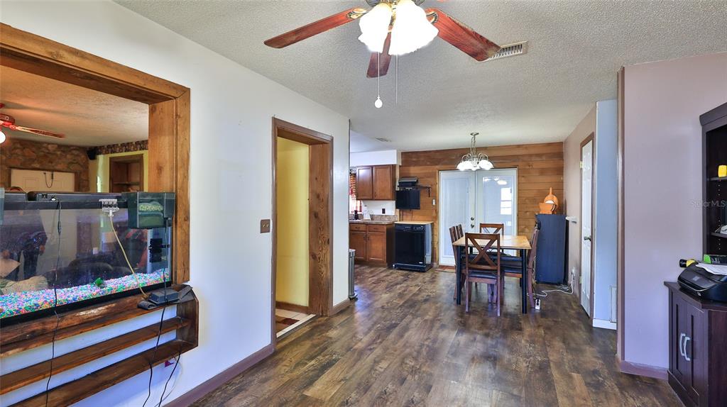 428 Perdita Avenue Edgewater, FL 32132 - Photo 7 of 28 a view of a kitchen and dining room