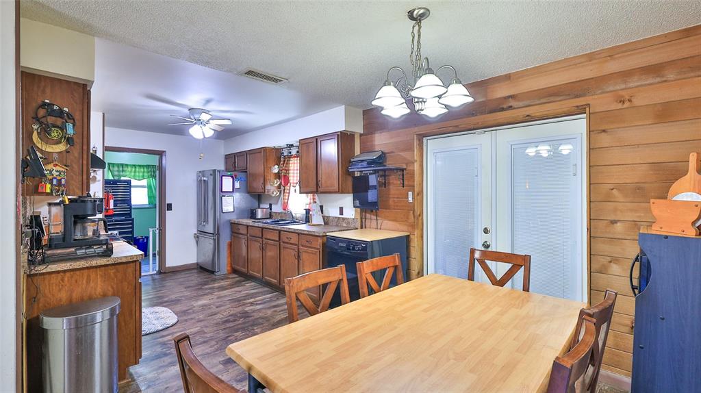 428 Perdita Avenue Edgewater, FL 32132 - Photo 9 of 28 a large kitchen with a table and chairs