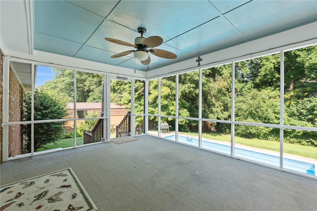 200 Echo Circle Easley, SC 29642 - Photo 22 of 35 A tranquil screened porch overlooks a private pool and verdant backyard, perfect for relaxation.