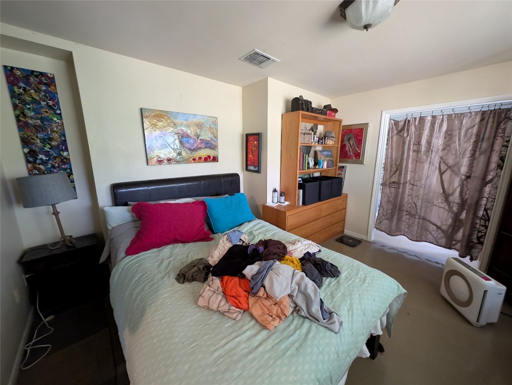 13603 Overland Pass Bee Cave, TX 78738 - Photo 15 of 30 a bedroom with a bed and a couch