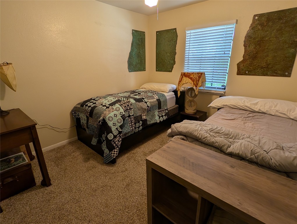 13603 Overland Pass Bee Cave, TX 78738 - Photo 18 of 30 a bedroom with two beds and painting on the wall
