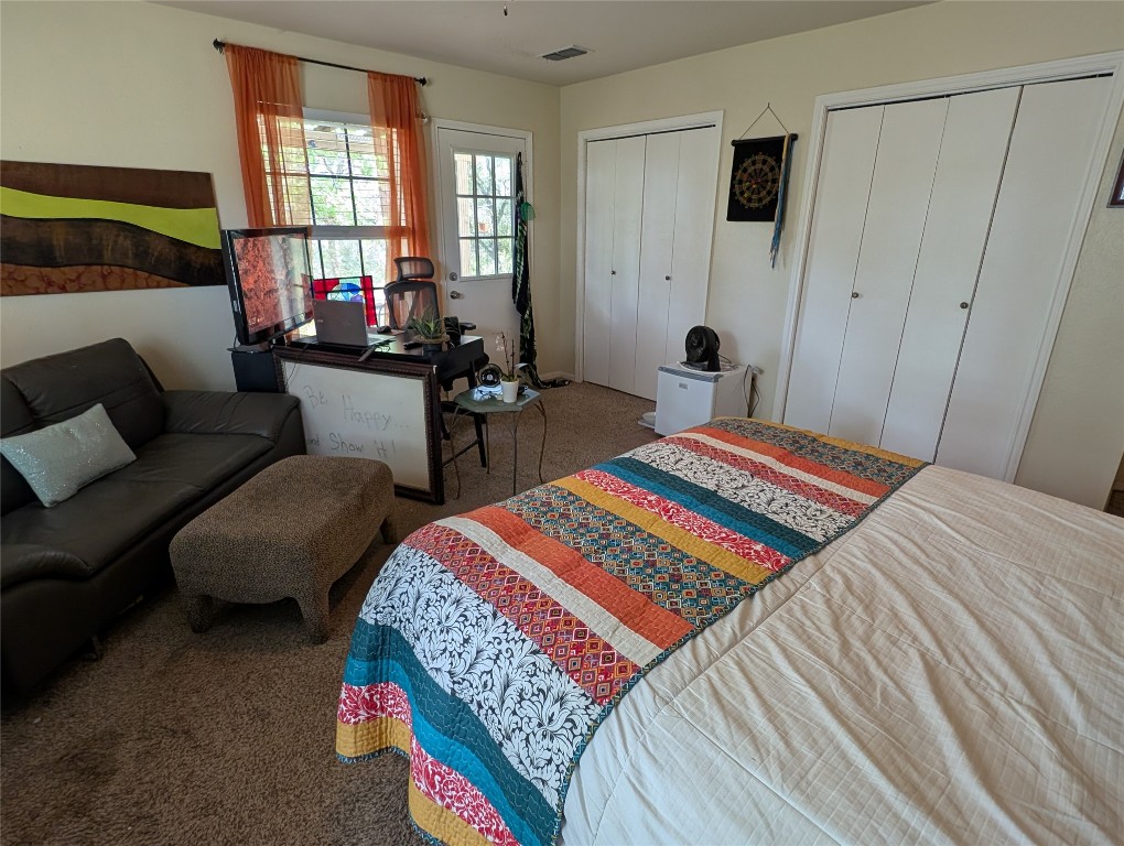 13603 Overland Pass Bee Cave, TX 78738 - Photo 20 of 30 a bedroom with two beds and a window