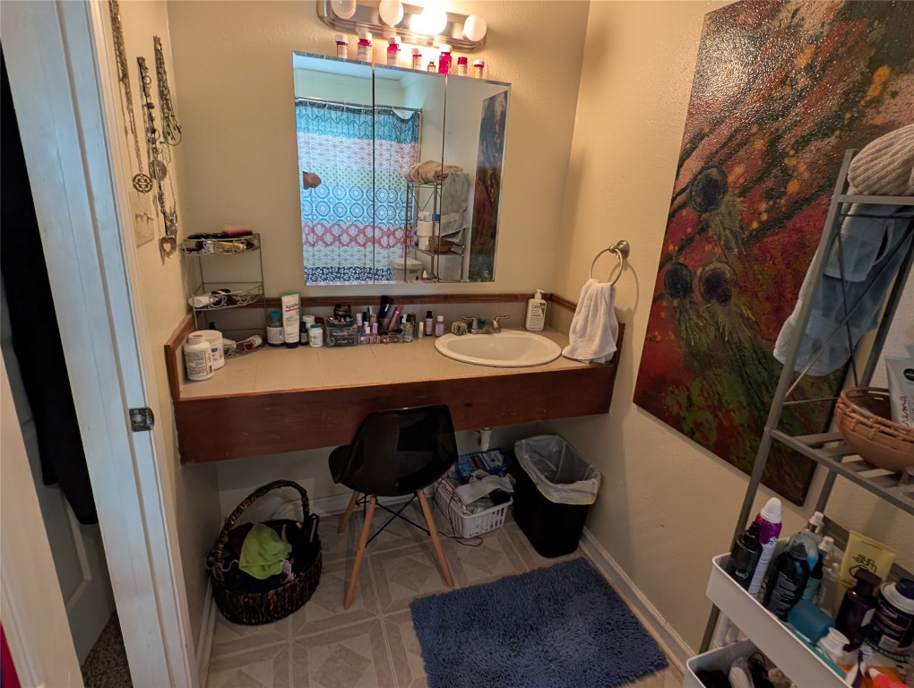 13603 Overland Pass Bee Cave, TX 78738 - Photo 21 of 30 a bathroom with a sink and a mirror