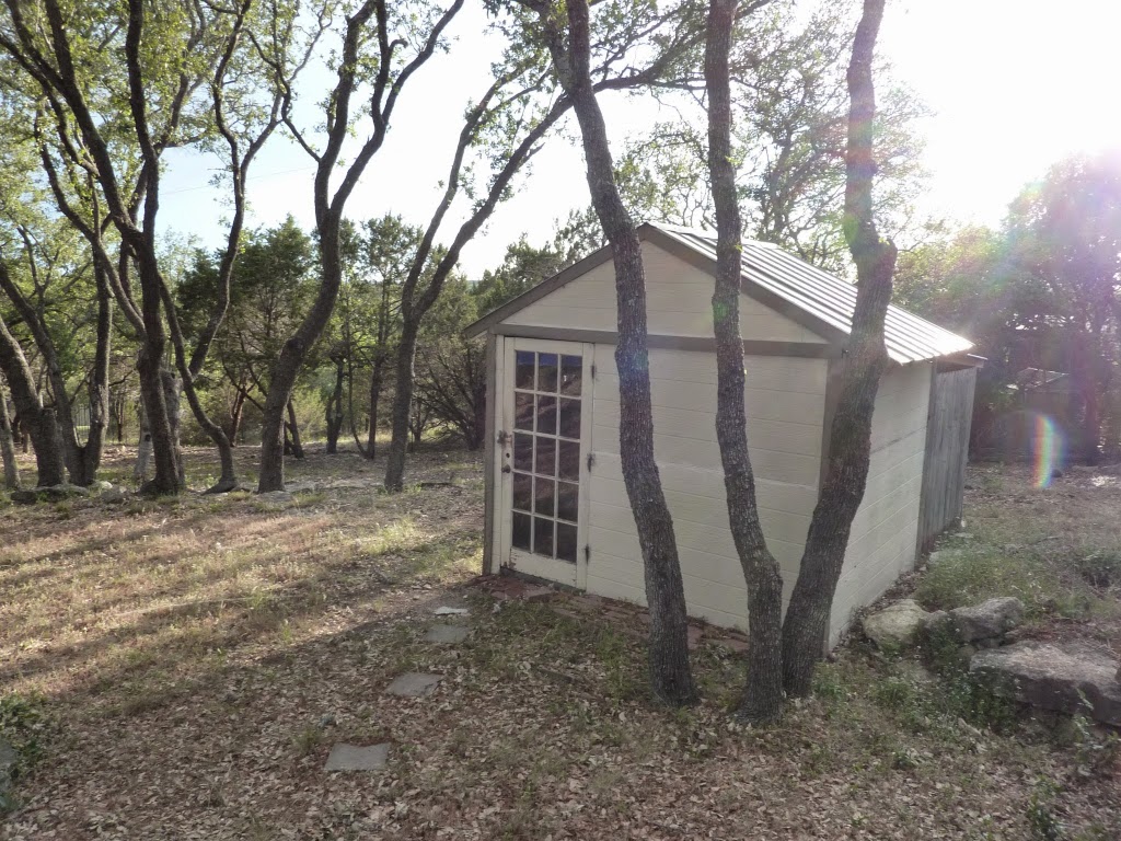 13603 Overland Pass Bee Cave, TX 78738 - Photo 25 of 30 a view of a house with a tree beside of a yard