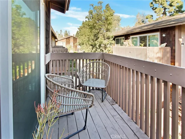 a view of a balcony with wooden floor