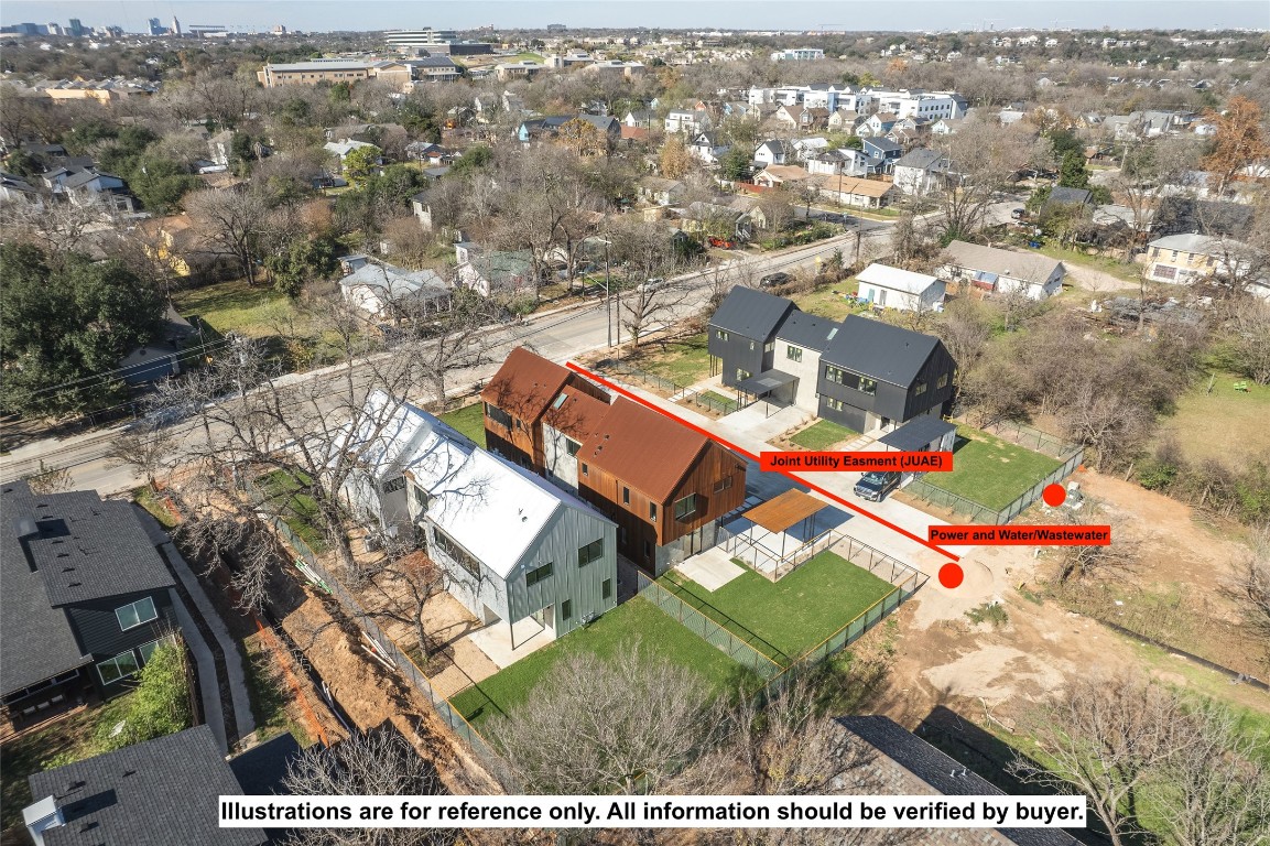 an aerial view of a houses with a yard