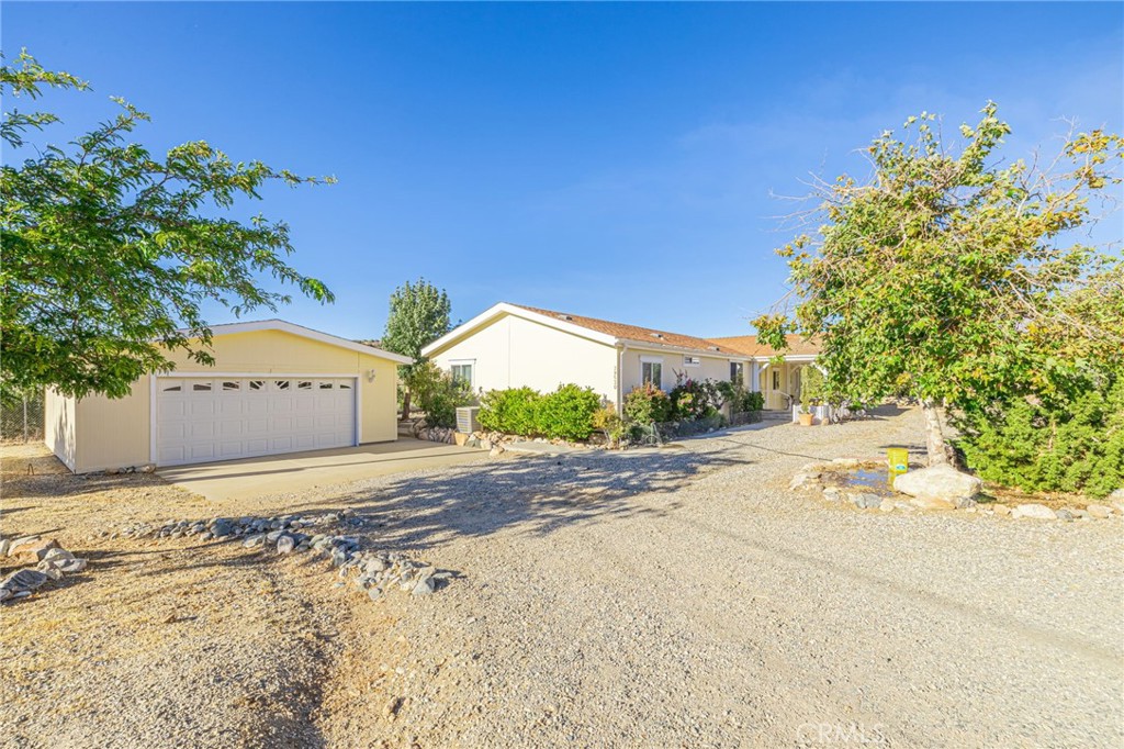 29520 Piani Road Pearblossom, CA 93553 - Photo 5 of 40 a view of a yard and front of a house
