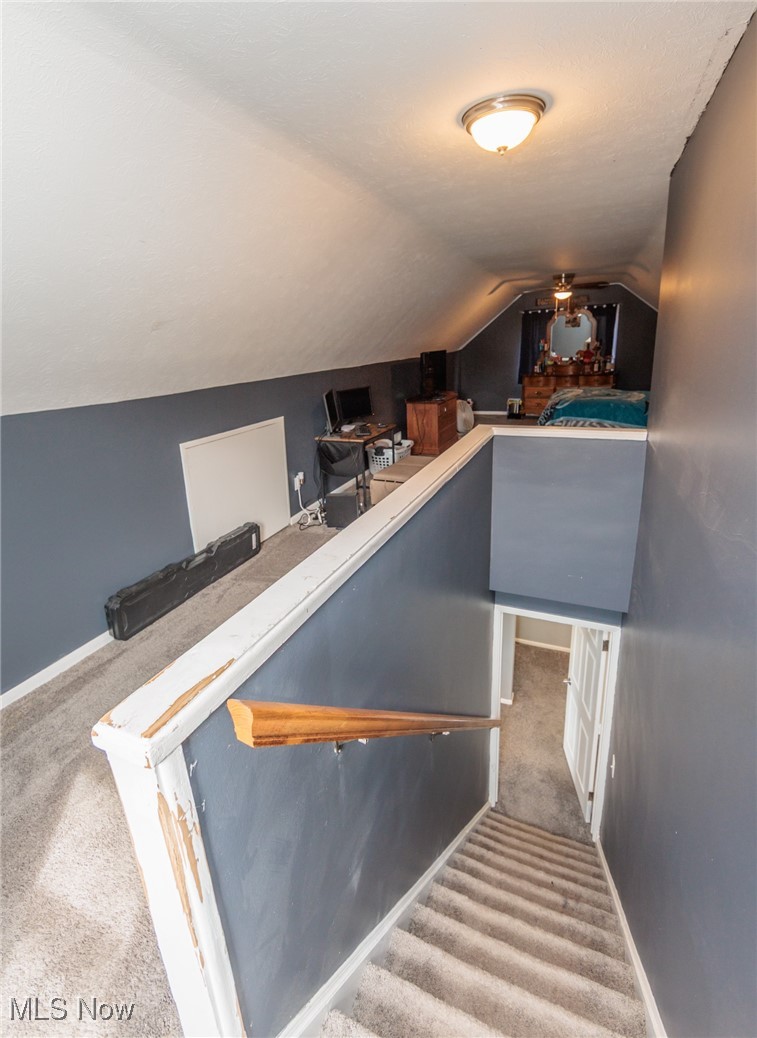 3443 Dentzler Road Parma, OH 44134 - Photo 32 of 48 Stairs featuring baseboards, lofted ceiling, and carpet