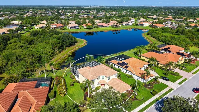 an aerial view of residential houses with outdoor space