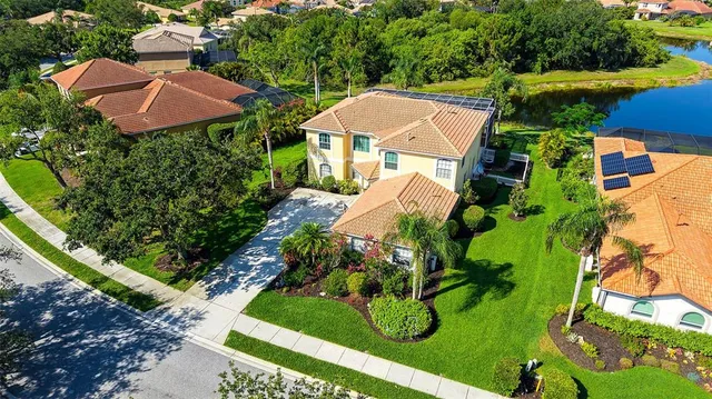 an aerial view of house with yard