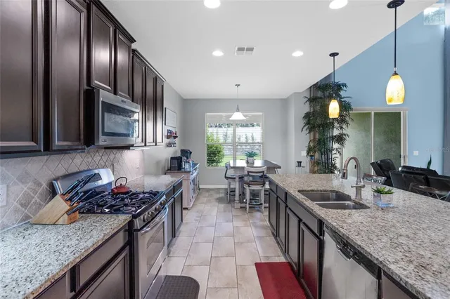 a view of a dining room with furniture window and outside view