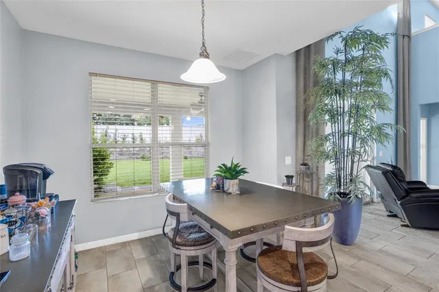 a bedroom with a bed a lamp and a chandelier