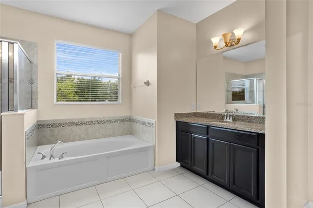 a bathroom with a bathtub and a sink