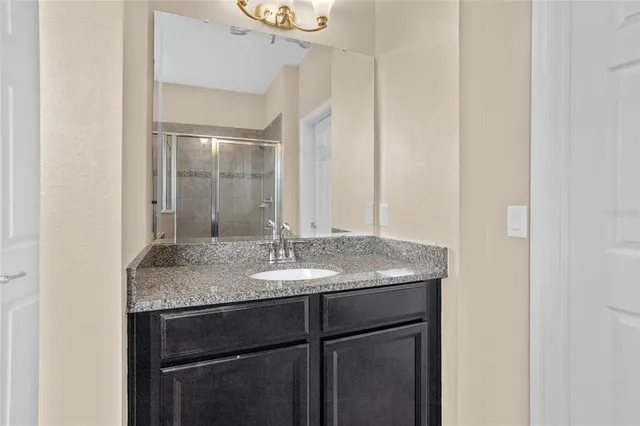 a view of walk in closet with clothes