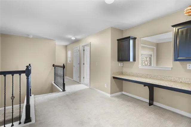 a white toilet sitting next to a bath tub