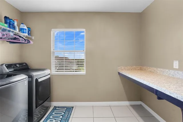 an empty room with closet and a ceiling fan
