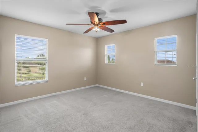 a bed room with furniture and a window