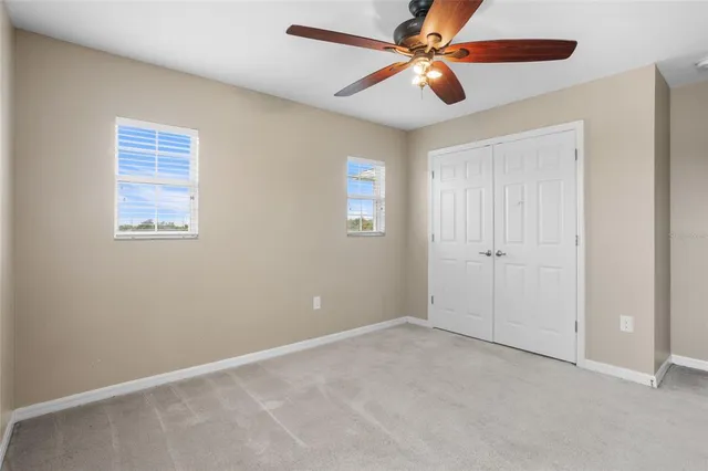 a bedroom with bed and a window