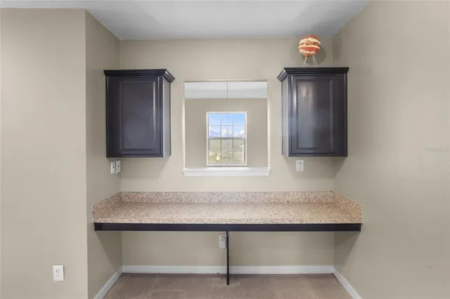 an aerial view of residential houses with outdoor space and swimming pool